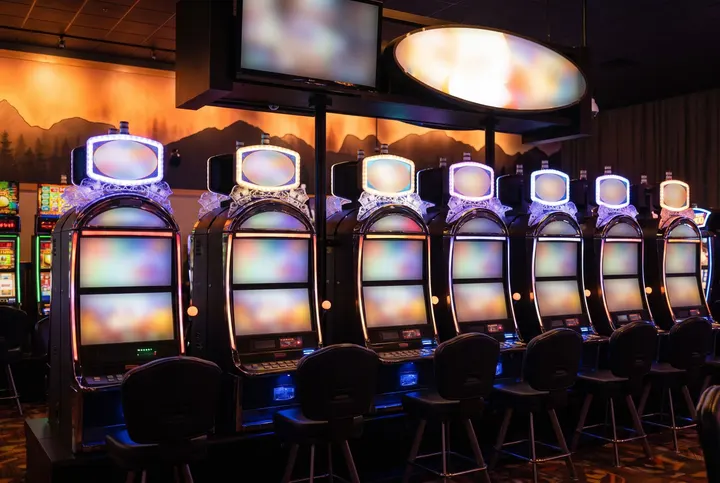 Row of slot machines on the casino floor